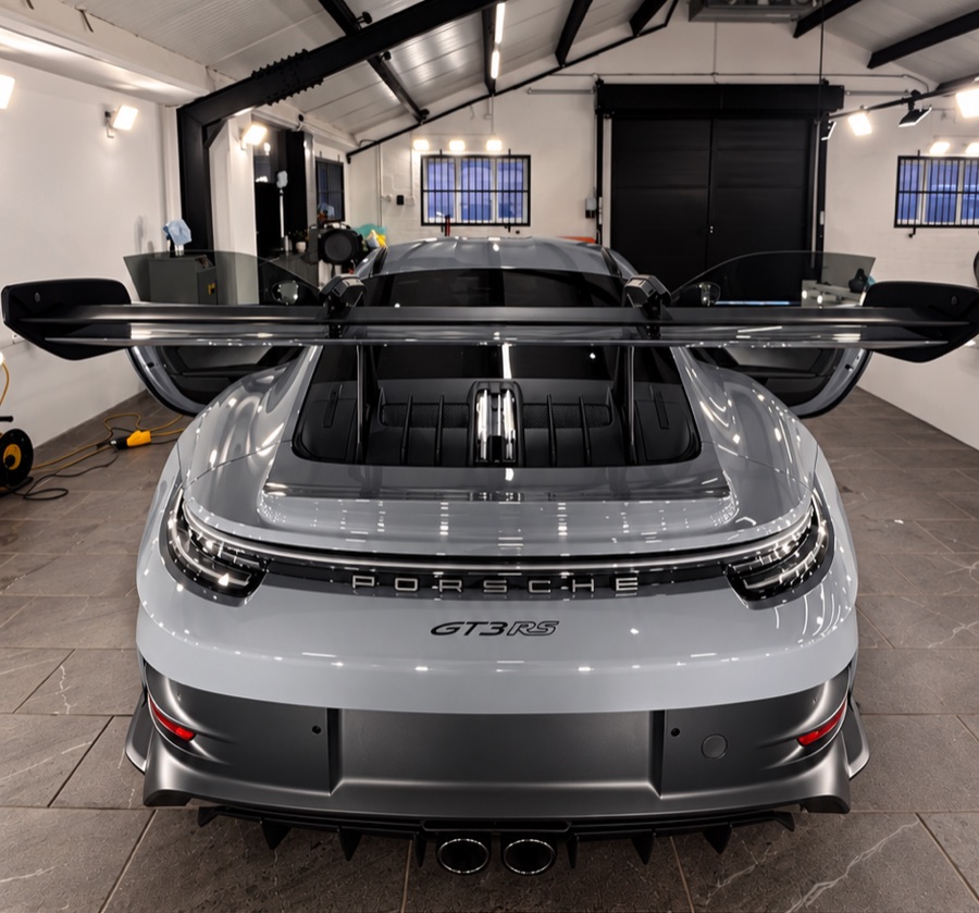 Rear view of a grey Porsche 911 GT3 RS with its distinctive rear wing, from LuxTint’s customer work